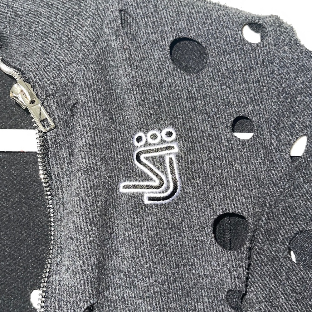 Grey jacket with wholes from Shane Justin